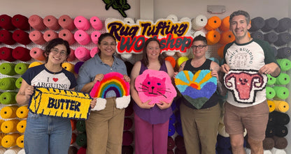 Group of people holding colorful foam roller crafts in a workshop setting.