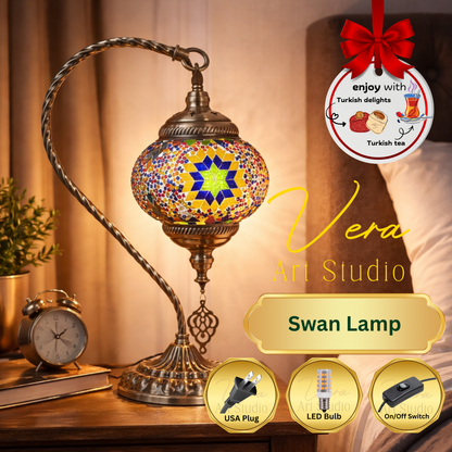 Mosaic Lamp Workshop Decorative swan lamp with colorful mosaic design on a wooden surface, featuring 'Vera Art Studio' branding.